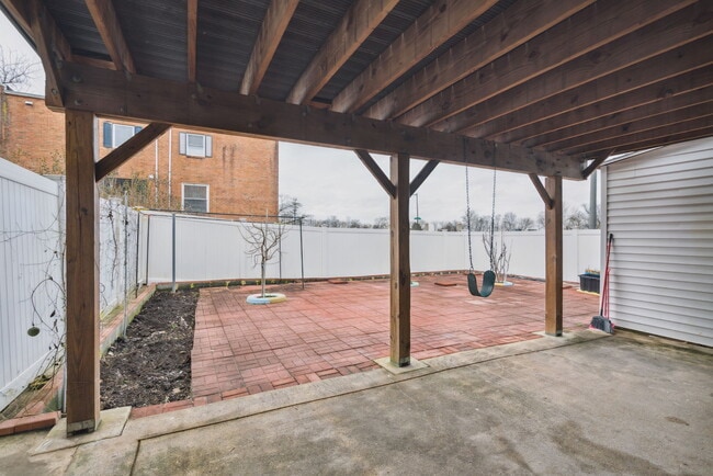 Backyard with Pavers, Fruit Trees and Garden Space - 100 Rennard Ter