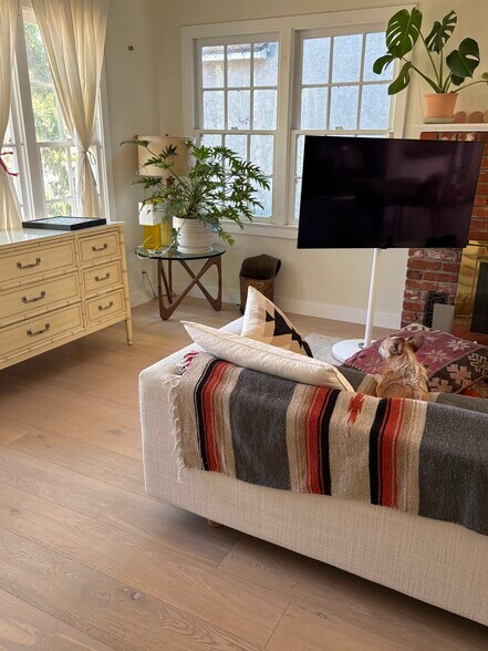 living room with mobile OLED smart TV - 607 S Beachwood Dr