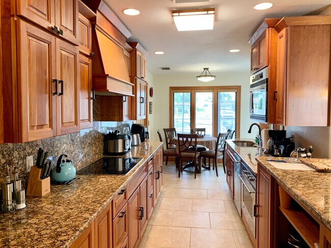 Building Photo - AVAILABLE 2027 SEASON! ! PGI HEATED POOL, WATERFRONT, BOAT LIFT