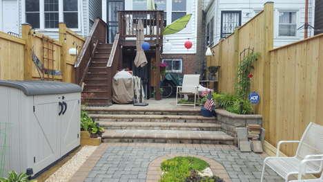 Back stone patio, parking pad, deck. - 526 24th St NE