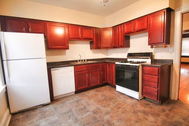 Building Photo - This 2 bedroom 1 bath home has been completely refinished with brilliant hardwood floors throughout!