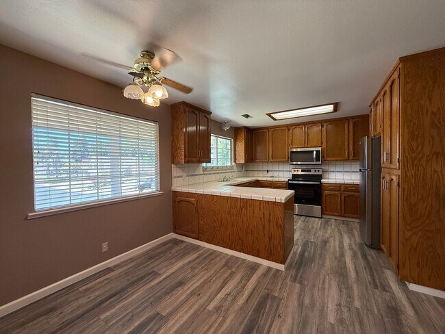 Building Photo - Stunning three-story home located in the c...