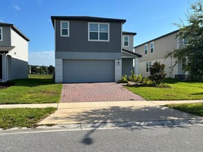 Building Photo - Like-New 4 Bedroom 3 Bath with Pond View & Two Living Spaces — Minutes to South Lake Nona