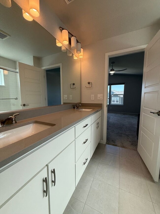 Building Photo - Stunning Luxury Living in Coal Creek with ...