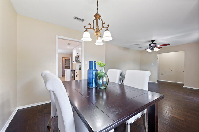 Building Photo - "Spacious 4-Bedroom Hardwood & Granite Fin...
