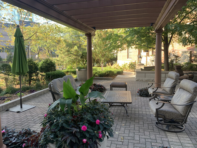 Pergolas and umbrellas to provide shade. - 500 E Grant St