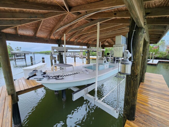 Building Photo - Gorgeous Riverfront 3/3 Saltwater Pool Hom...