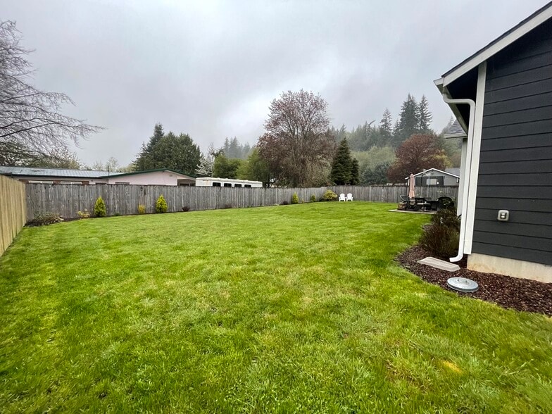 Large fully fenced backyard. - 627 N 3rd St
