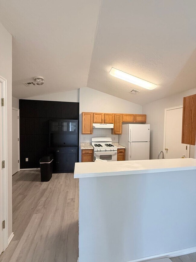 Building Photo - 4 Bedroom - 2 bath duplex located near campus and State Highway 9