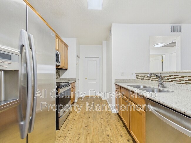 Building Photo - 10239 W 55th Dr