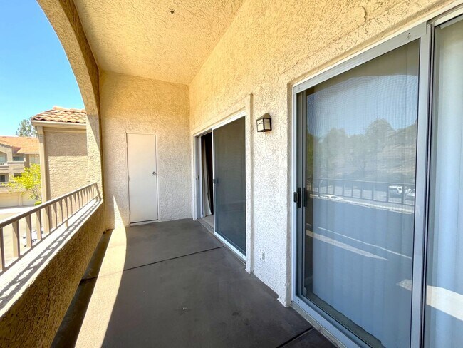 Building Photo - 1BR Condo with Private Balcony, Central A/C & Community Amenities in Corona