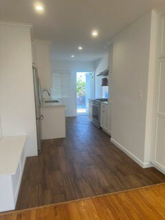 Kitchen area and looking toward backyard - 7851 1/2 Flight Ave