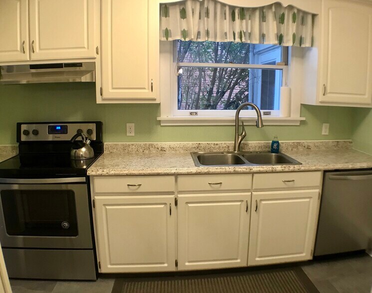 Kitchen has new floor, counter, oven, dishwasher and fixtures. - 2308 Buckingham Ave