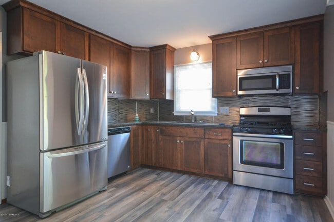 Building Photo - Cape Cod style home - completely updated throughout!