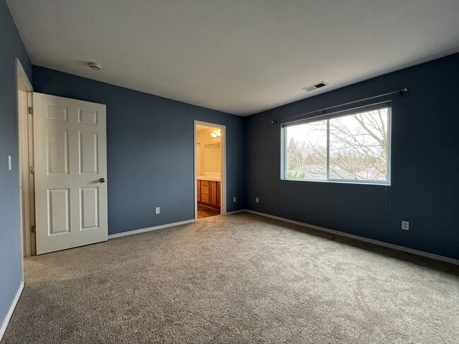 Building Photo - Inviting Two-Story 3BR Home Featuring New Carpet, New Stainless Appliances, Spacious Garage Stora...