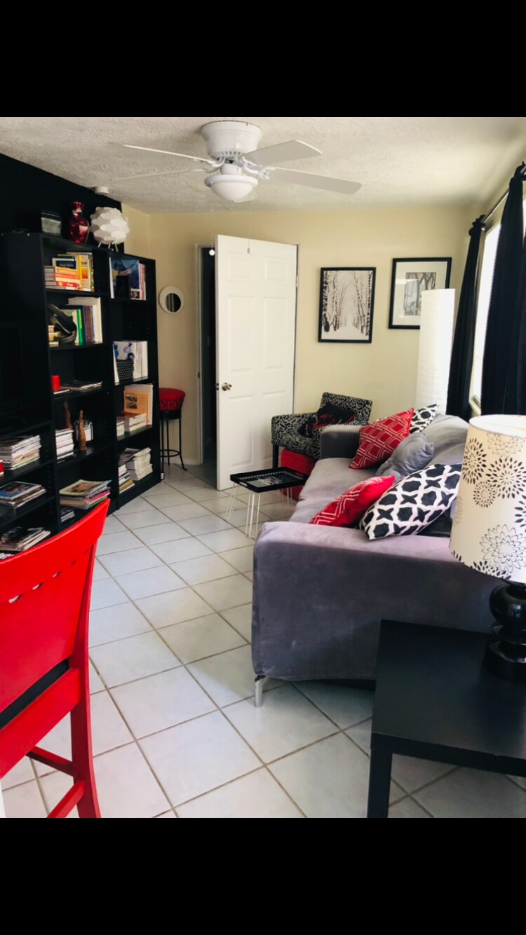 Living room with its library bookcase - 5703 Murdock Ave