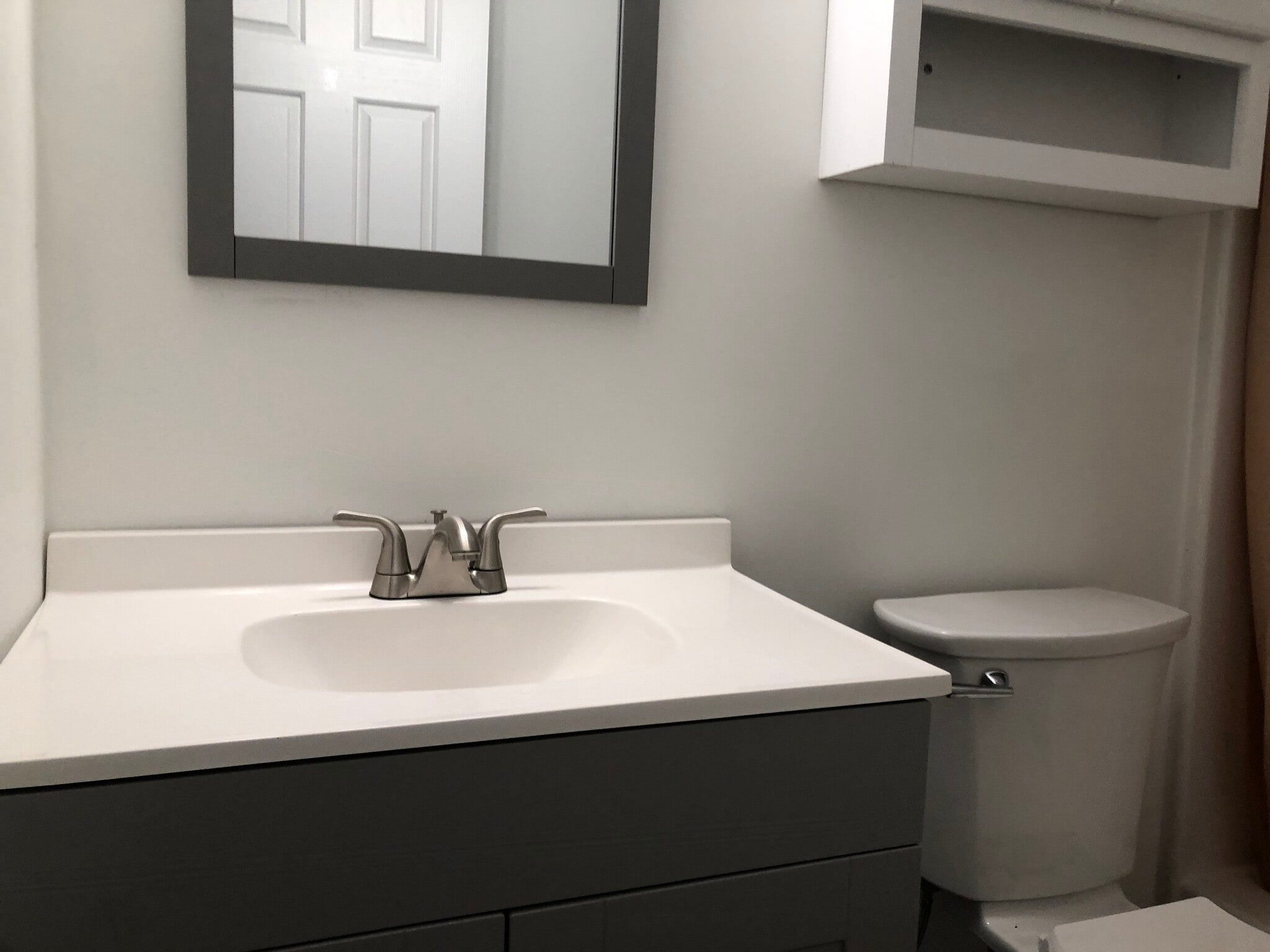 New bathroom vanity with modern fixtures. - 261 Simpson Ave