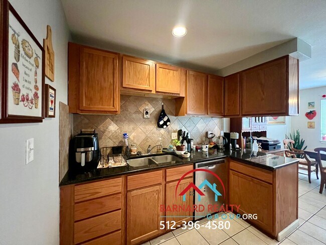 Building Photo - Available July 18: 3 bedroom, 2.5 Bath Duplex with Garage and Fenced Yard