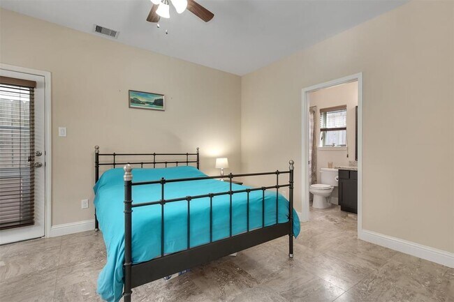 First Floor Bedroom With Door for Quick Access To Patio Area (With Pet Door) - 921 W 24th St