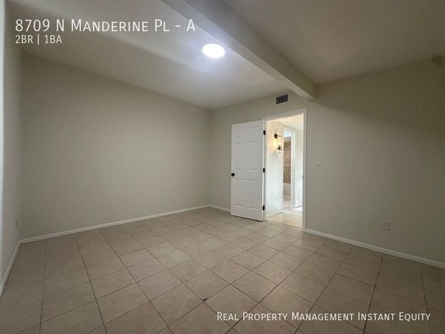 Building Photo - 8709 N Mandarine Pl