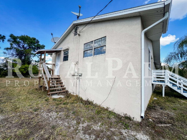 Building Photo - 4 Bedrooms, 2 Bathrooms & a Huge Backyard — Spacious Lehigh Acres Home with Pet-Friendly Living o...