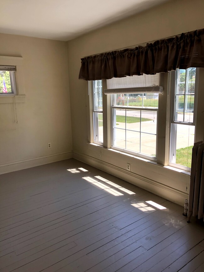 Living room with large window - 25 5th Ave