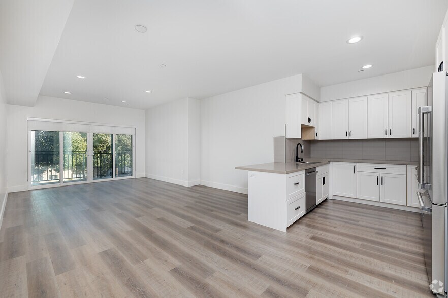 3BR, 2BA - 1,320SF - Living Room - 857 N Hayworth Ave