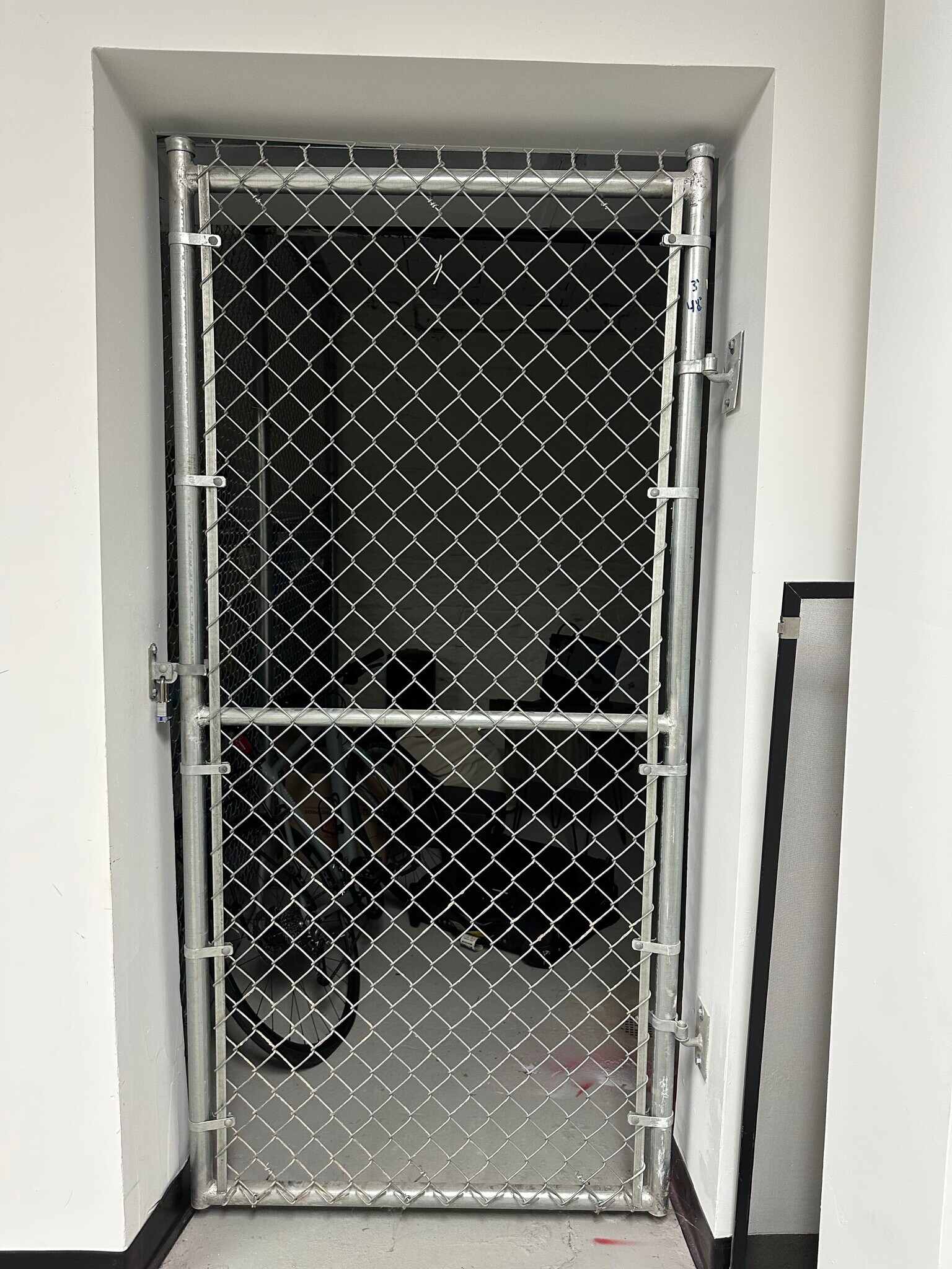 Gated storage unit for secure storage. In Basement. - 1523 Republic St