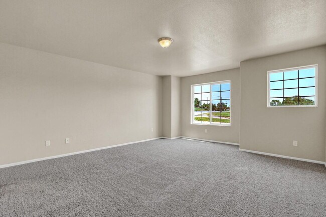 Building Photo - Modern Townhome with Central A/C, 2-Car Ga...