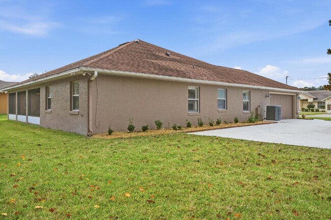 Building Photo - "Charming 3-Bedroom Home with 2 Full Baths and 2032 Sq Ft of Comfort in Palm Coast!"