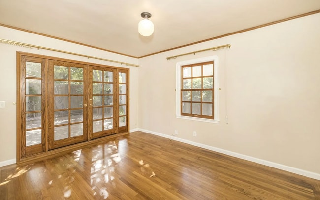 Building Photo - Charming Spanish Style Cottage with Incredible Deck- Gardener's Delight!