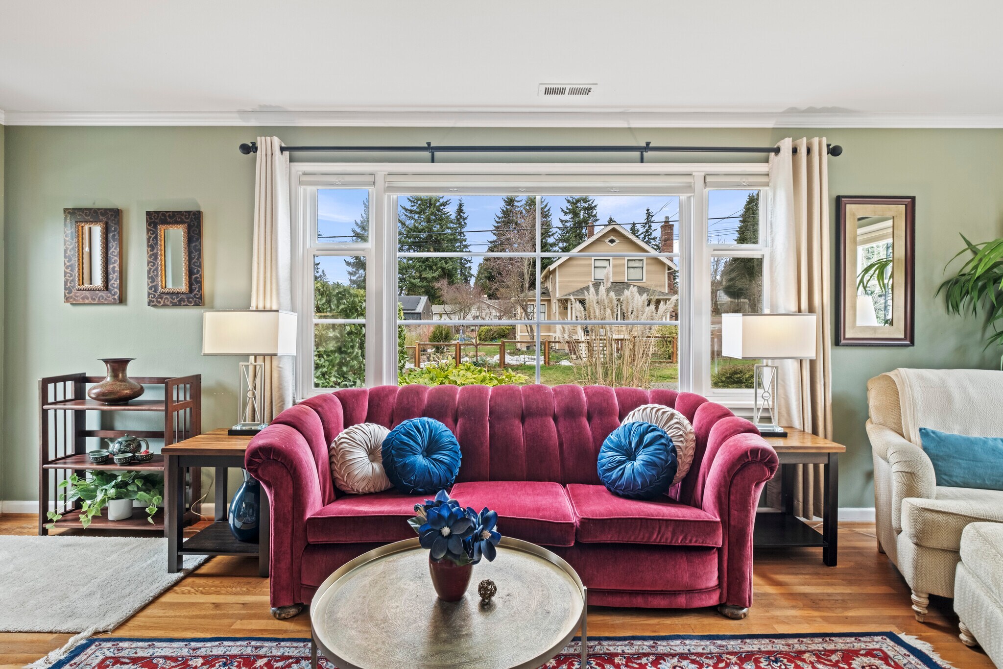 Sun-filled living room with peaceful neighborhood views. - 11639 1st Ave NW
