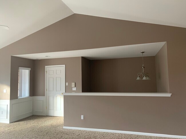 Living room looking at staircase and closet/office room - 51870 Adler Park Dr E