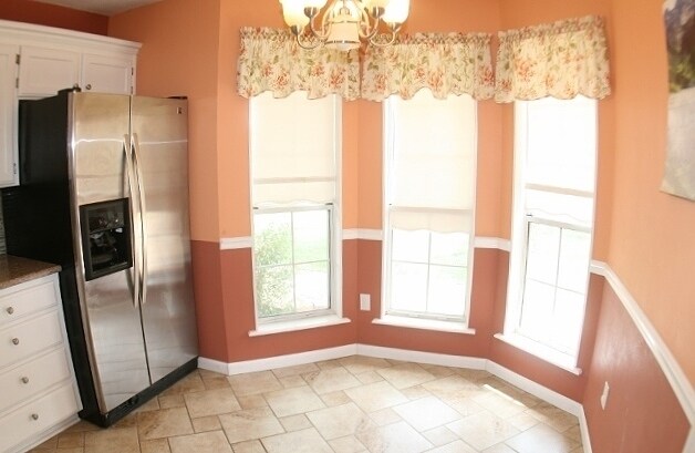 Building Photo - Brick 3 Bedroom Home! Stunning Backyard! M...