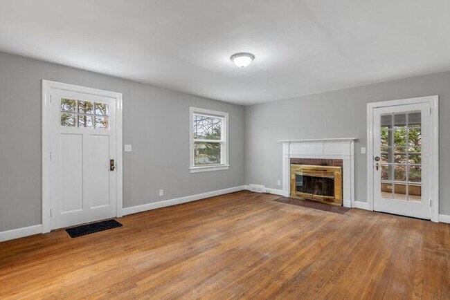 Building Photo - Brick home, Two Story, Hardwoods, DR, 2 Sun Rooms, FP, Carport!.