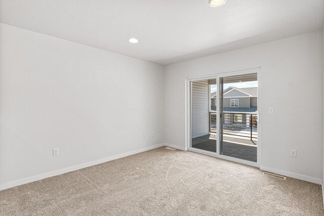 Building Photo - New 3 Bed Townhome with Covered Deck and Oversized Garage!