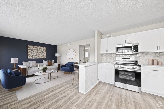 Cook and entertain in a newly renovated kitchen with sleek black appliances and modern finishes.
