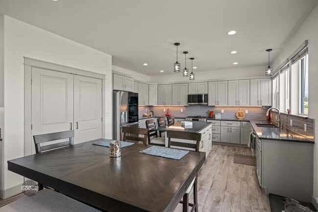 Building Photo - Premium 4BR Rental in The Ranch | Stunning Mountain Views | Easy Community Location | Automatic G...
