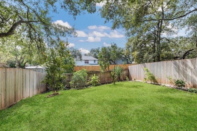 Building Photo - ***APPLICATION CURRENTLY UNDER REVIEW***Modern Elegance: 3-Bedroom Townhome with Wood Flooring, S...