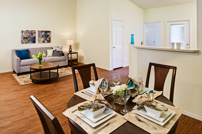 Living and dining room - Courtyards at Kirnwood Apartment Homes