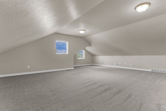 Building Photo - Spacious Syracuse Home with Covered Deck, Loft & Oversized 3-Car Garage