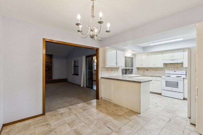 Building Photo - Welcome to this charming 3-bedroom, 2-bath...