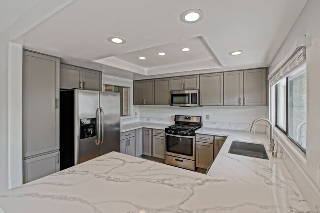 Building Photo - PRIME POOLFRONT LOCATION & CLOSE TO MAIN GATE! BRIGHT & SPACIOUS, END-UNIT POOLFRONT TOWNHOUSE W/...