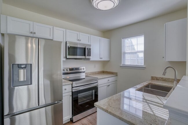 Building Photo - New, New, New - Spacious 3 Bedroom Townhouse with a Finished Basement !!
