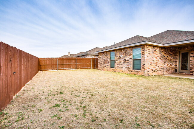 Building Photo - Granite Glam & Backyard Fun: Welcome to Yo...