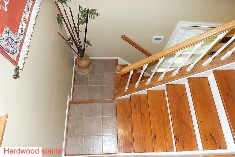 Stairs with hardwood floor - 11809 Rockaway Ln