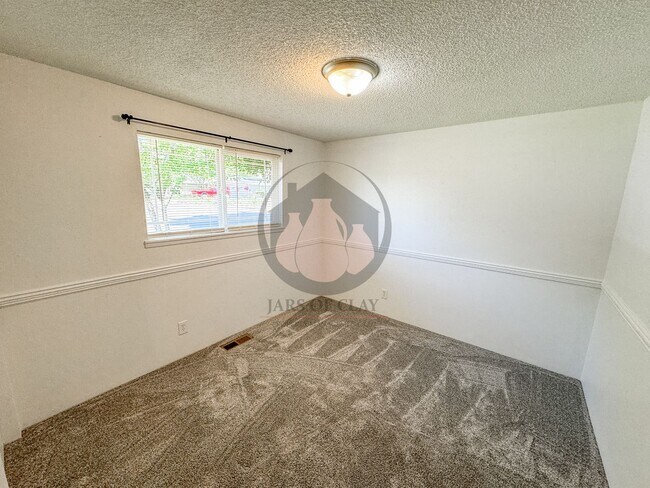 Building Photo - READY NOW! Charming Single-Level 3BD/2BA with Central AC, Wood Fireplace, and Landscaping Included!