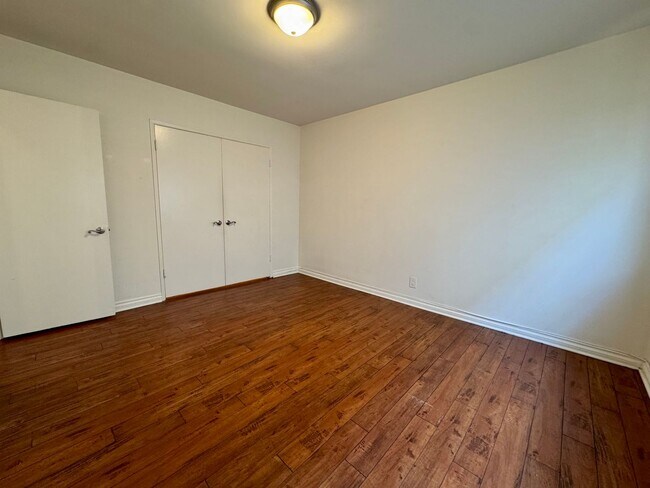 Building Photo - Updated Lower apartment with Hardwood Floo...