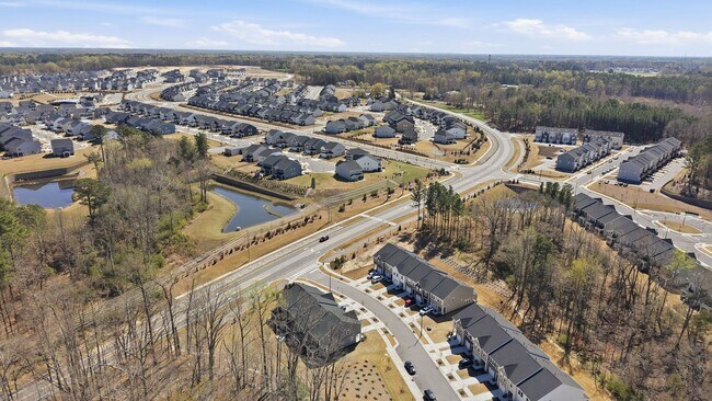 Building Photo - Upgraded 3BR Townhome in Wake Forest | Open Layout, Garage & Resort-Style Amenities