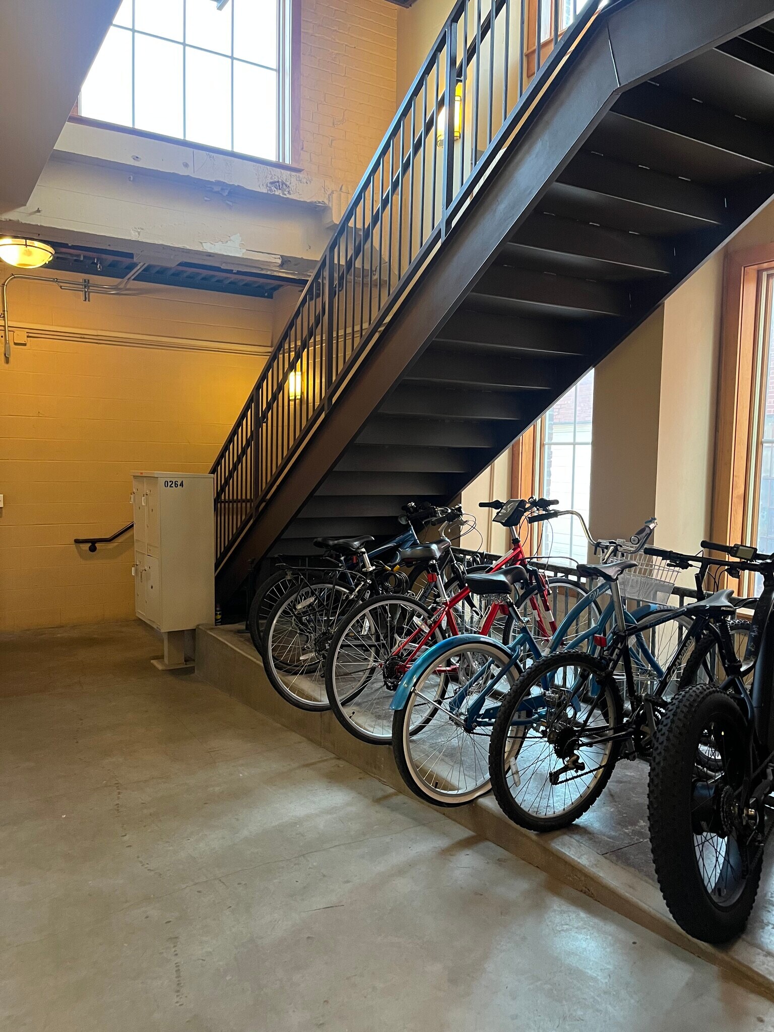 Mailboxes, stairwell, bike racks. - 201 S Saint Francis Ave